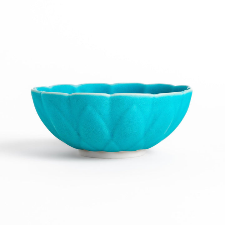 Turkish blue lotus-shaped dessert bowl with a smooth matte finish, featuring intricate petal-like details and a contrasting white base, perfect for serving desserts.
