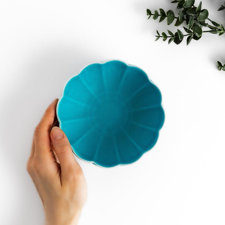 Turkish blue lotus-shaped dessert bowl with a smooth matte finish, featuring intricate petal-like details and a contrasting white base, perfect for serving desserts.