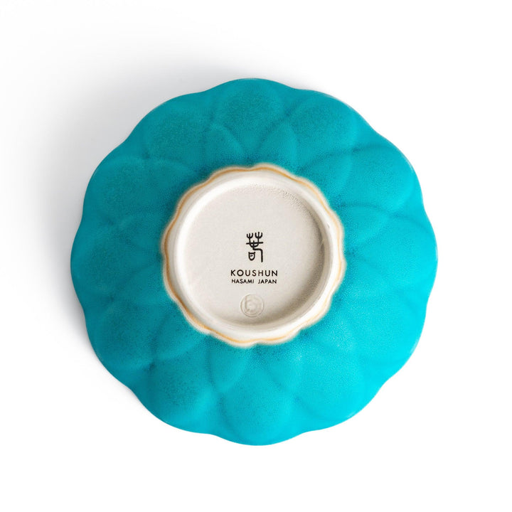 Turkish blue lotus-shaped dessert bowl with a smooth matte finish, featuring intricate petal-like details and a contrasting white base, perfect for serving desserts.