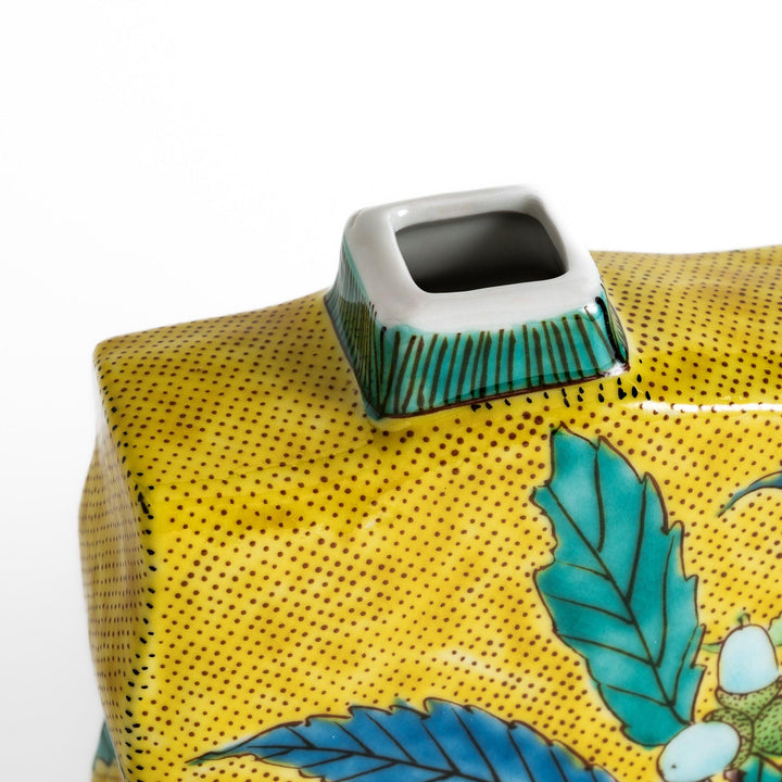 Beautiful yellow flower vase featuring vibrant fruit and leaf designs, perfect for adding a touch of color and elegance to any space.