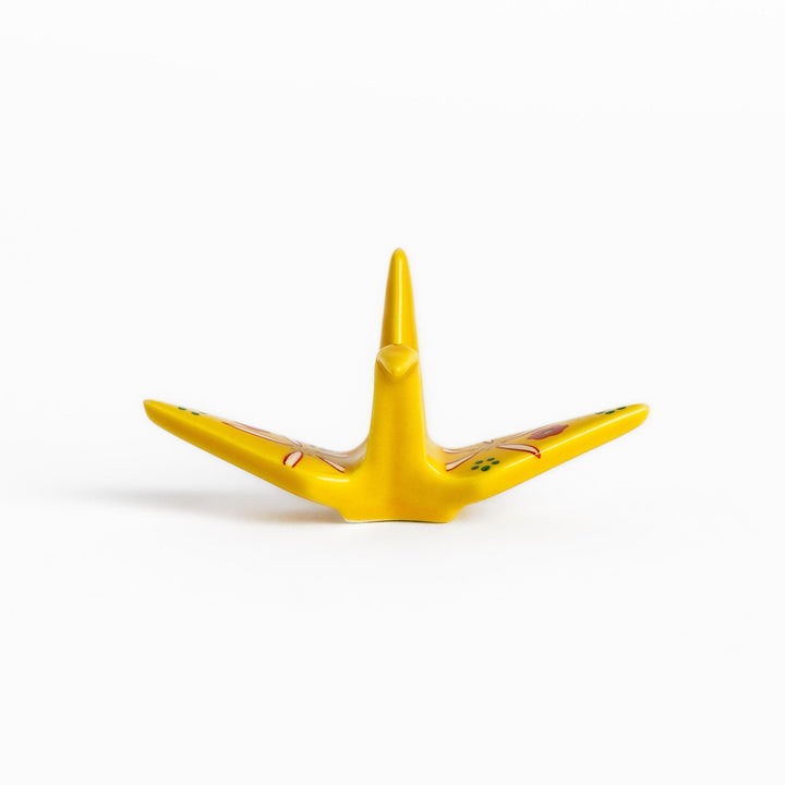 Colorful yellow origami crane incense holder with intricate floral patterns, perfect for adding charm and serenity to your space.