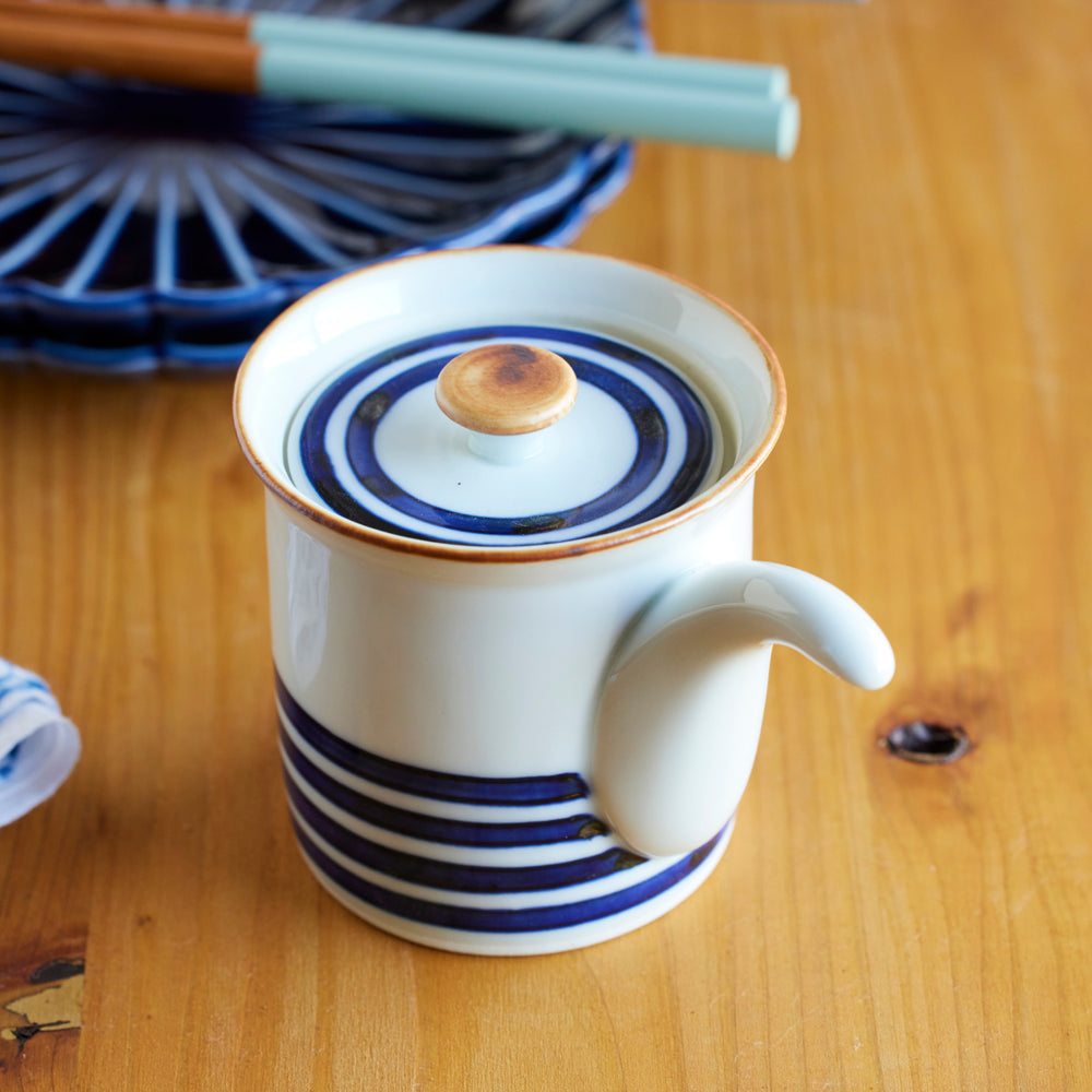 Japanese ceramic soy sauce dispenser with lid, featuring indigo blue stripes and natural glaze, ideal for authentic tableware.
