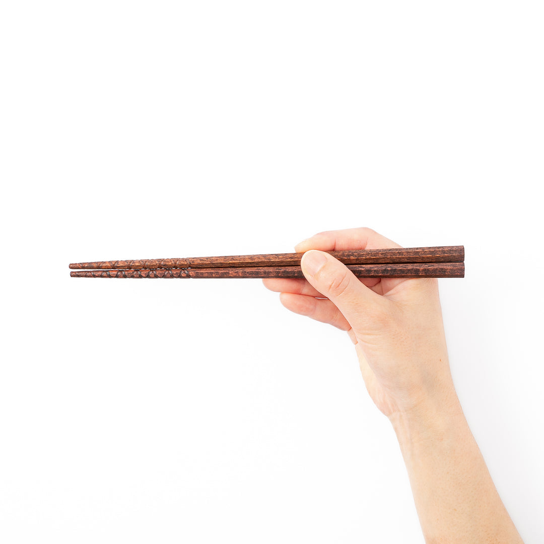 Octagonal natural wood Japanese chopsticks with a textured grip at the tips specifically designed for eating ramen noodles