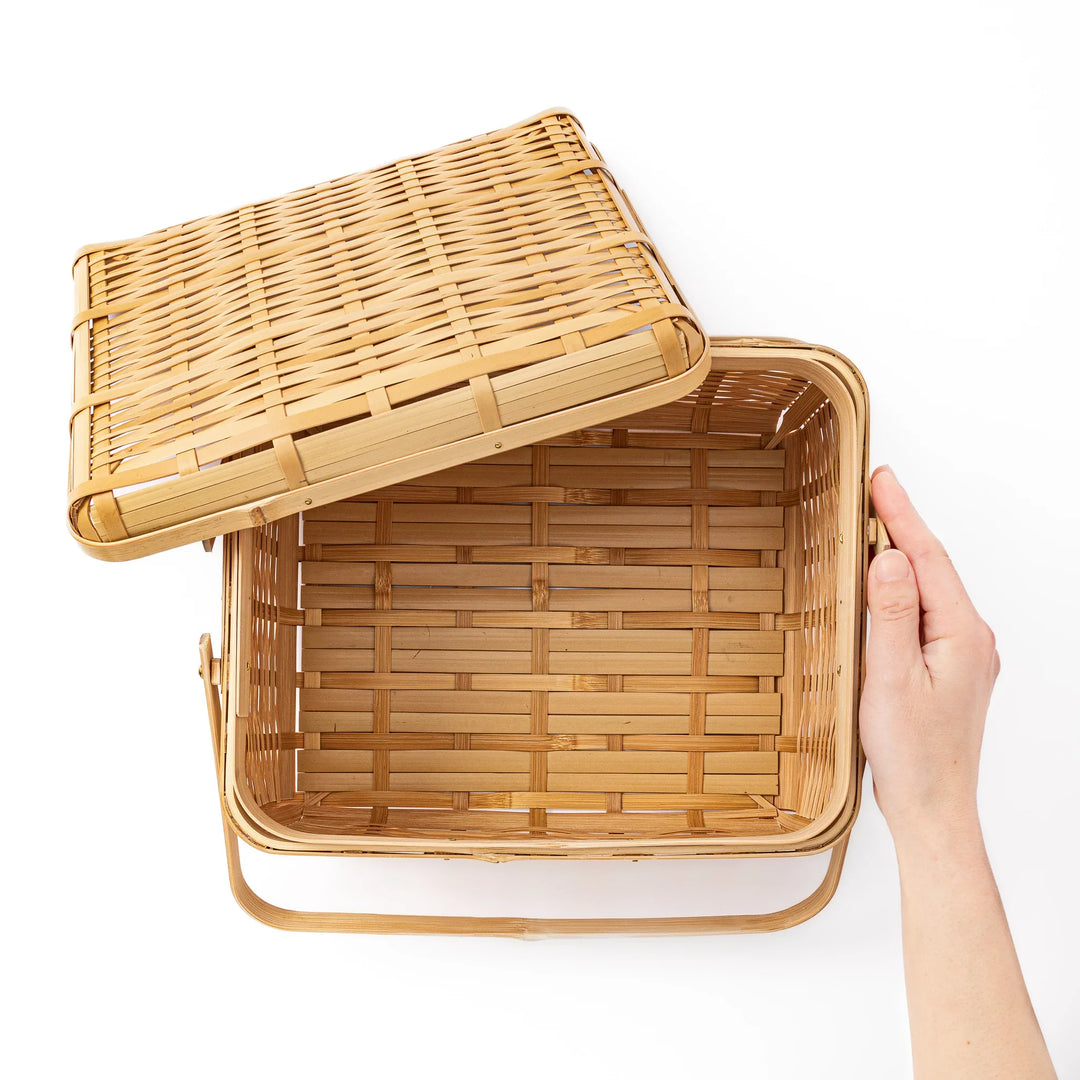 Open Japanese bamboo storage basket with lid showing a spacious interior for organized home storage or picnic meals