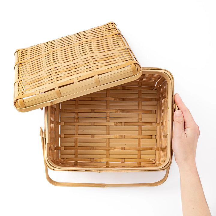 Open Japanese bamboo storage basket with lid showing a spacious interior for organized home storage or picnic meals