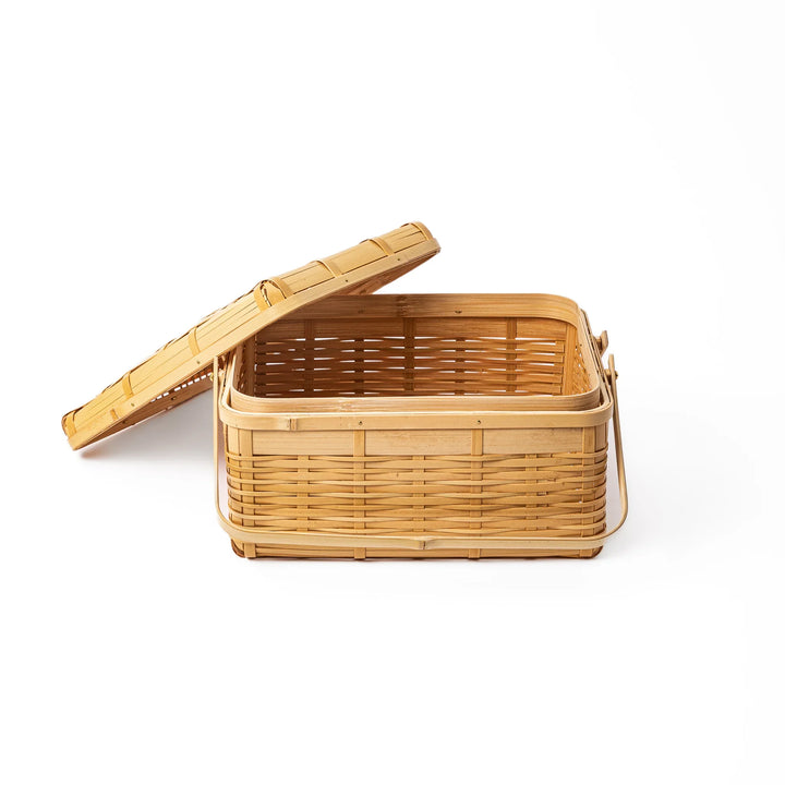 Open Japanese bamboo storage basket with lid showing a spacious interior for organized home storage or picnic meals