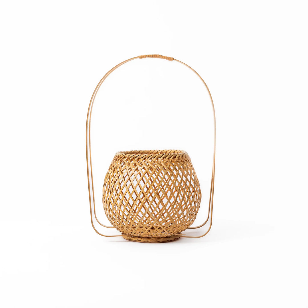 Handwoven Japanese bamboo Ikebana flower basket with a tall arched handle for traditional floral arrangements