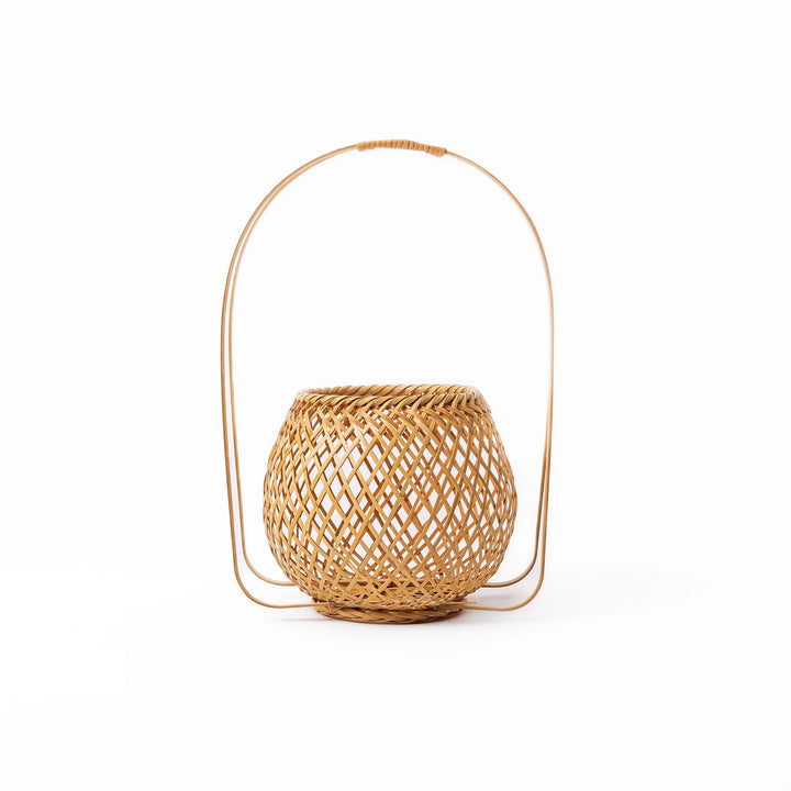 Handwoven Japanese bamboo Ikebana flower basket with a tall arched handle for traditional floral arrangements