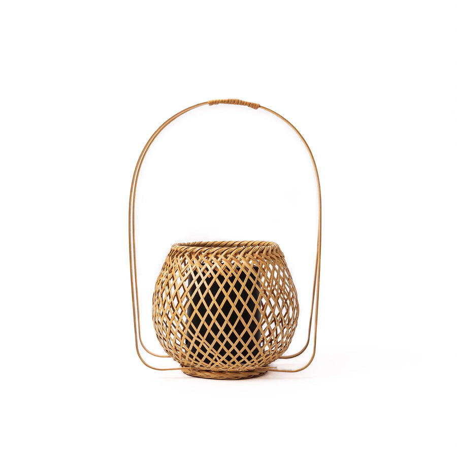 Handwoven Japanese bamboo Ikebana flower basket with a tall arched handle for traditional floral arrangements