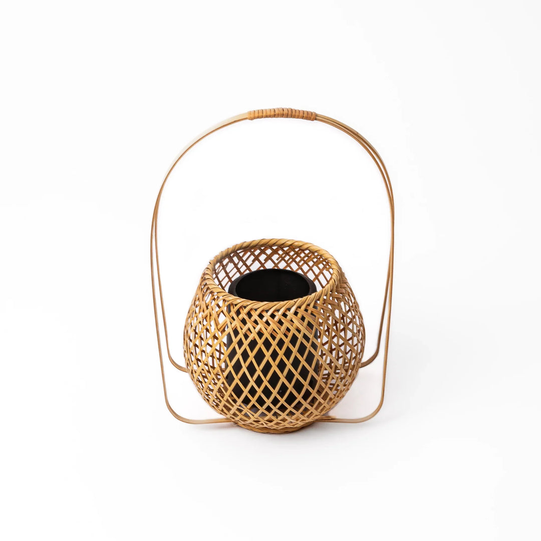 Handwoven Japanese bamboo Ikebana flower basket with a tall arched handle for traditional floral arrangements