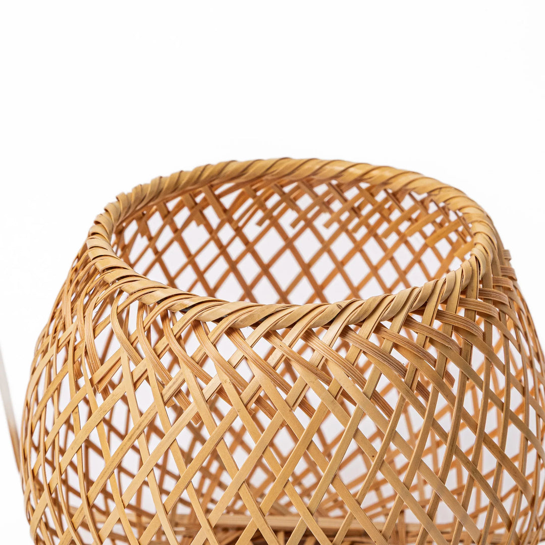 Handwoven Japanese bamboo Ikebana flower basket with a tall arched handle for traditional floral arrangements