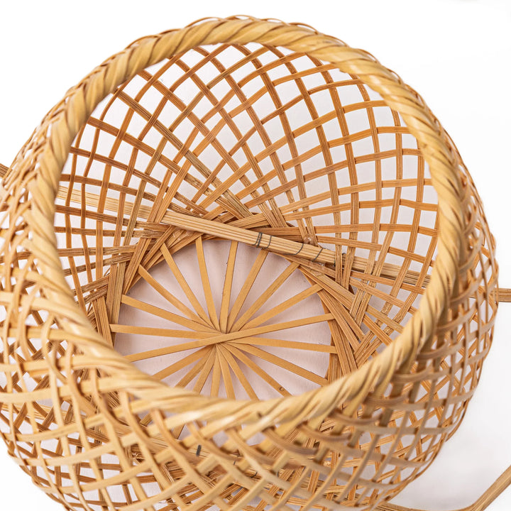 Handwoven Japanese bamboo Ikebana flower basket with a tall arched handle for traditional floral arrangements