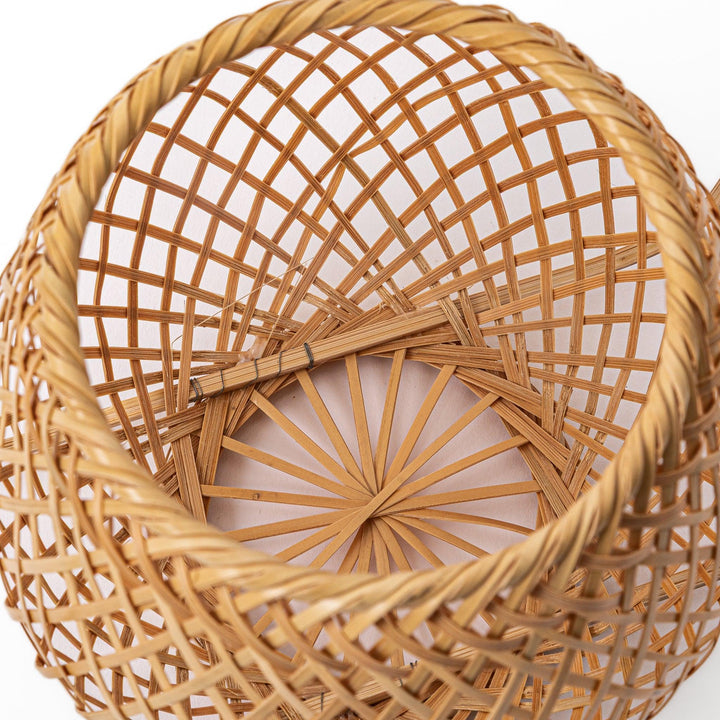 Handwoven Japanese bamboo Ikebana flower basket with a tall arched handle for traditional floral arrangements