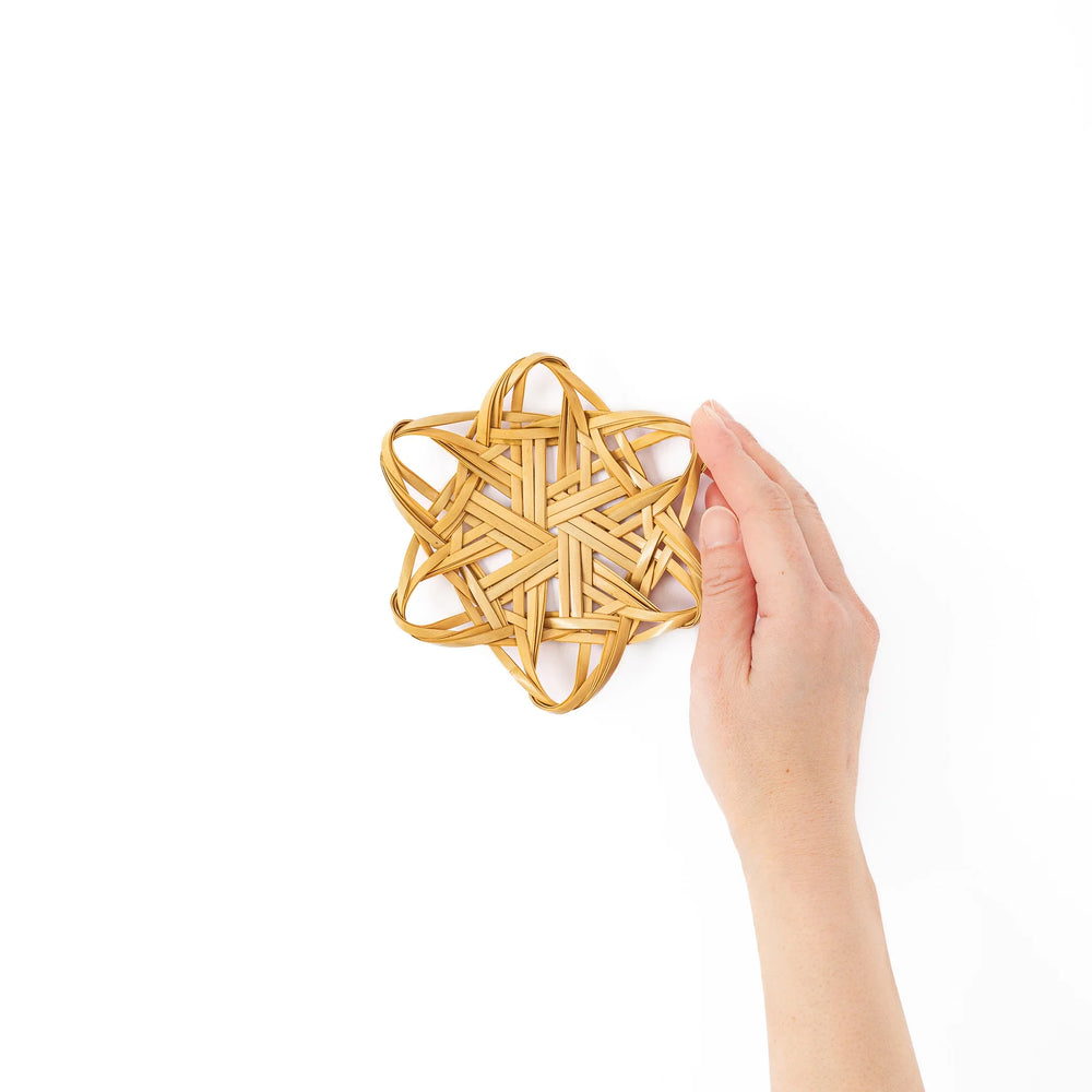 Handwoven star shaped Japanese bamboo flower tea coaster for elegant table decor and traditional green tea service