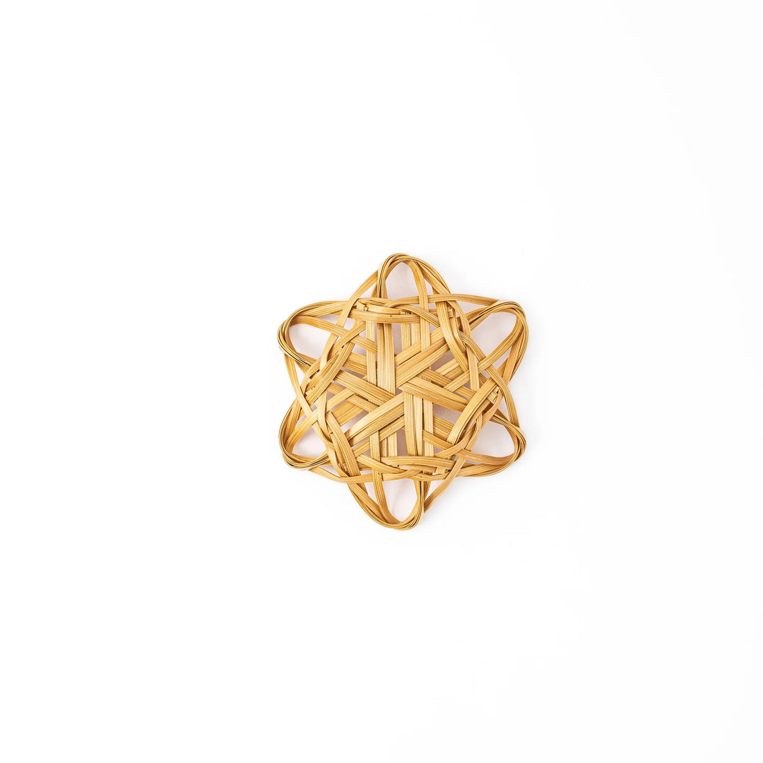 Handwoven star shaped Japanese bamboo flower tea coaster for elegant table decor and traditional green tea service