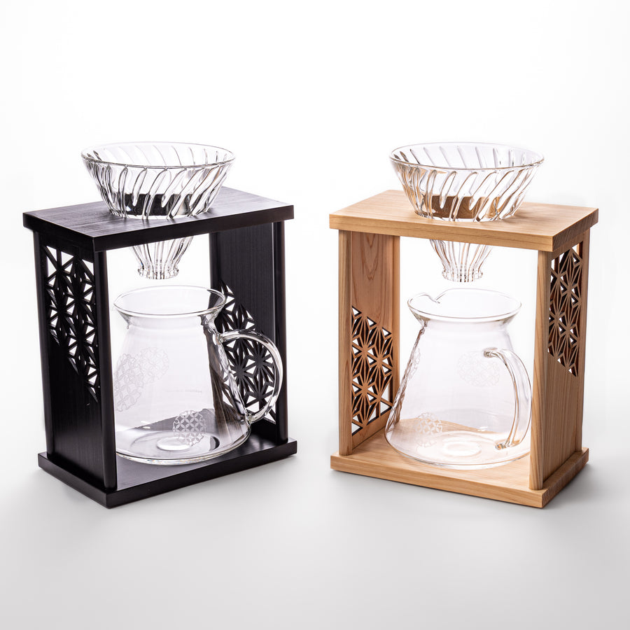 Japanese wood coffee dripper stands with Asanoha kumiko pattern side by side, comparing black and natural finish options
