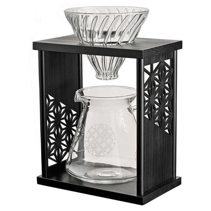 Displaying hario aya asanoha black wood coffee dripper set with clear glass pour over cone and server in carved stand