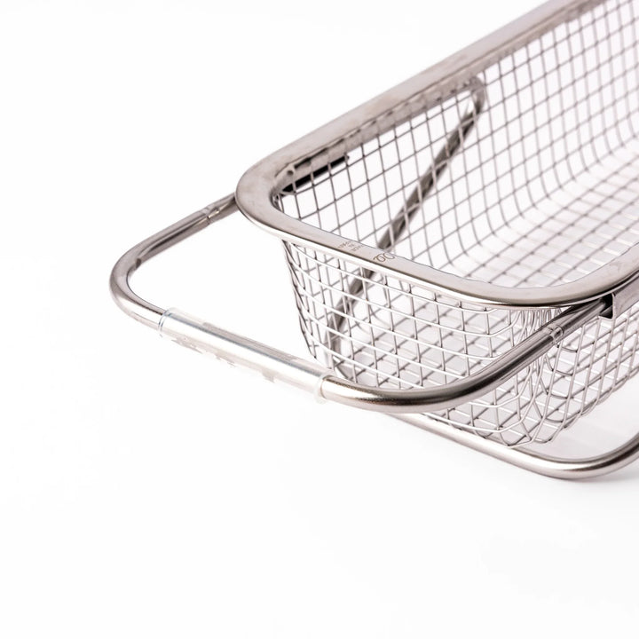 Stainless steel rectangular strainer basket with handles for draining noodles or frying in Japanese cooking.