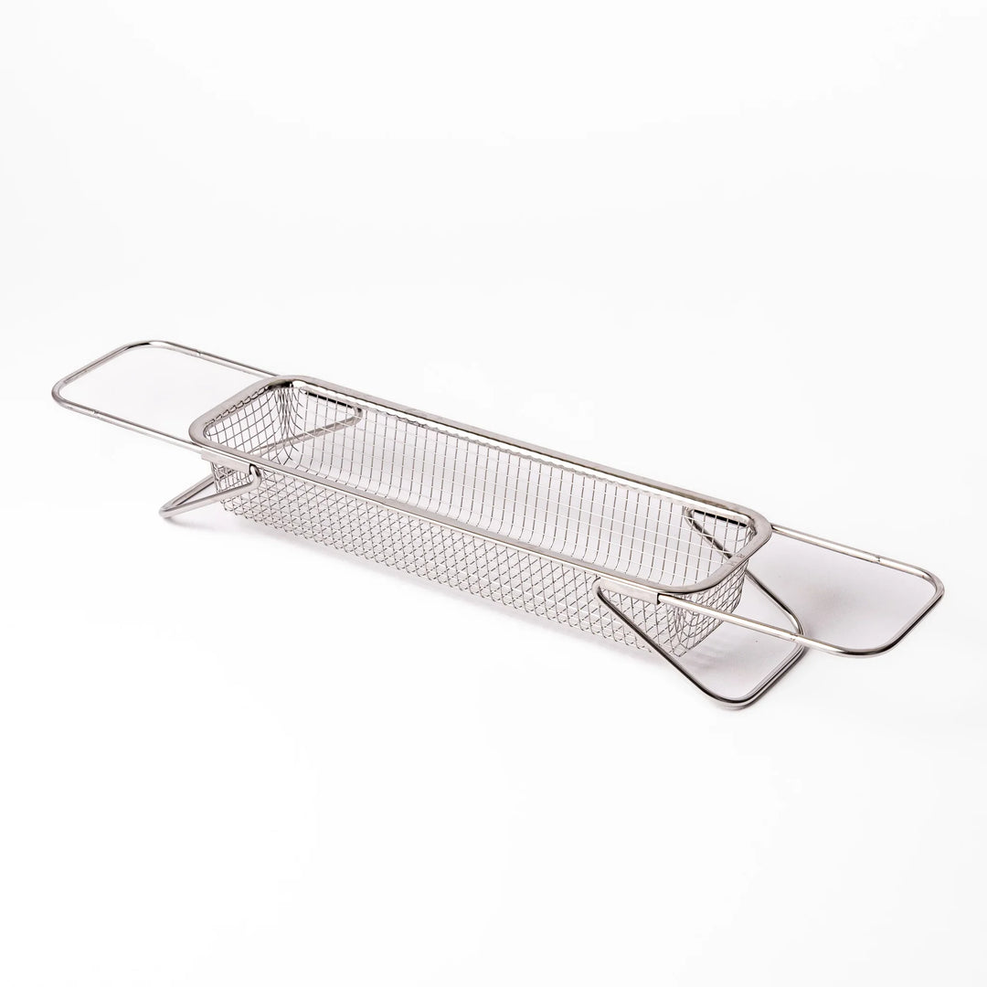 Stainless steel rectangular strainer basket with handles for draining noodles or frying in Japanese cooking.