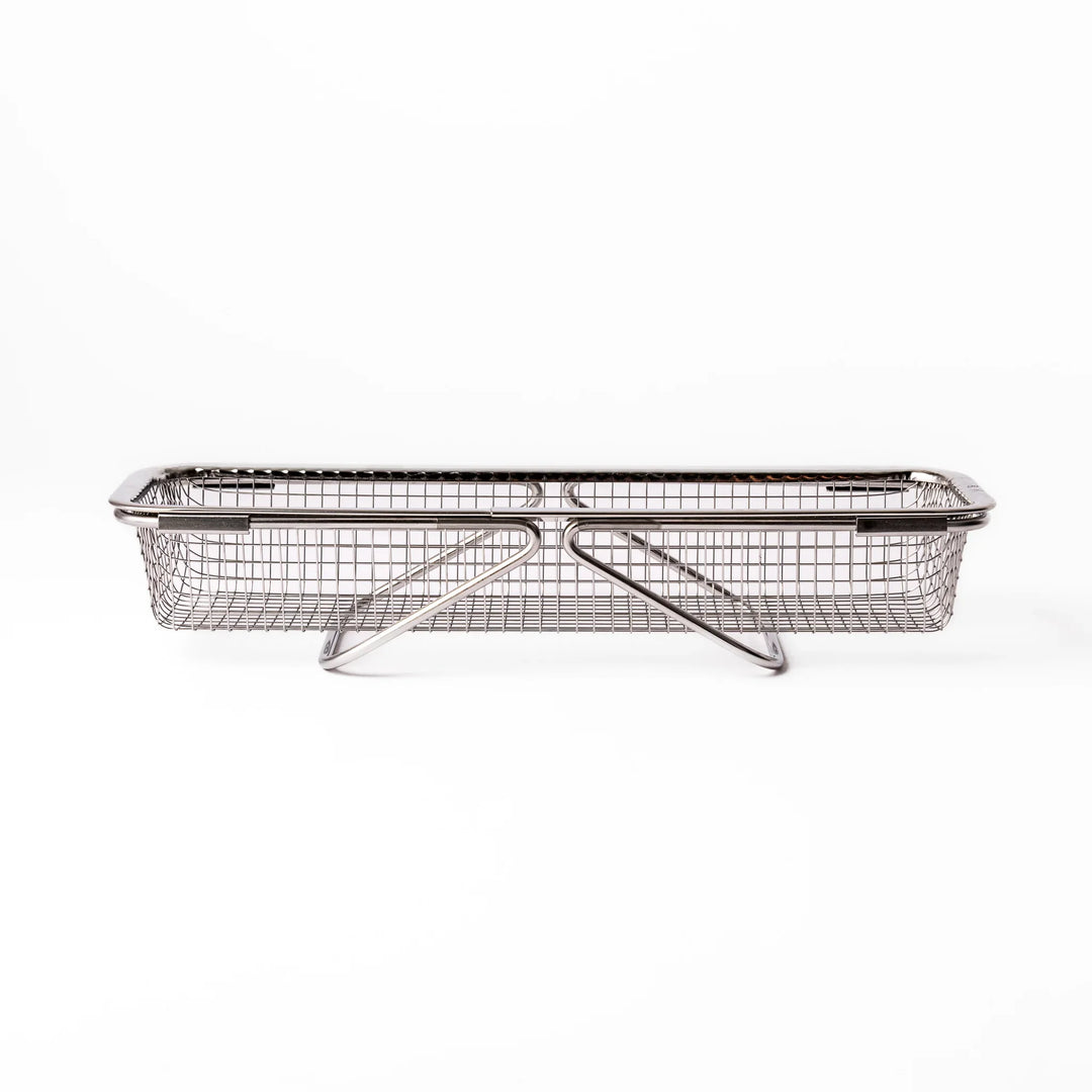 Stainless steel rectangular strainer basket with handles for draining noodles or frying in Japanese cooking.
