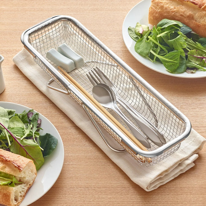 Stainless steel rectangular strainer basket with handles for draining noodles or frying in Japanese cooking.