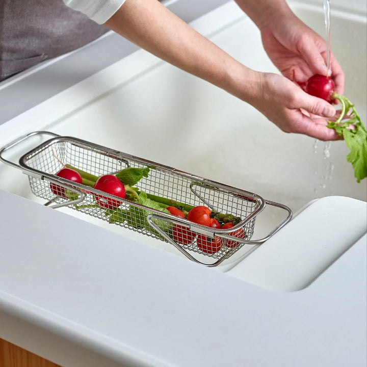 Stainless steel rectangular strainer basket with handles for draining noodles or frying in Japanese cooking.