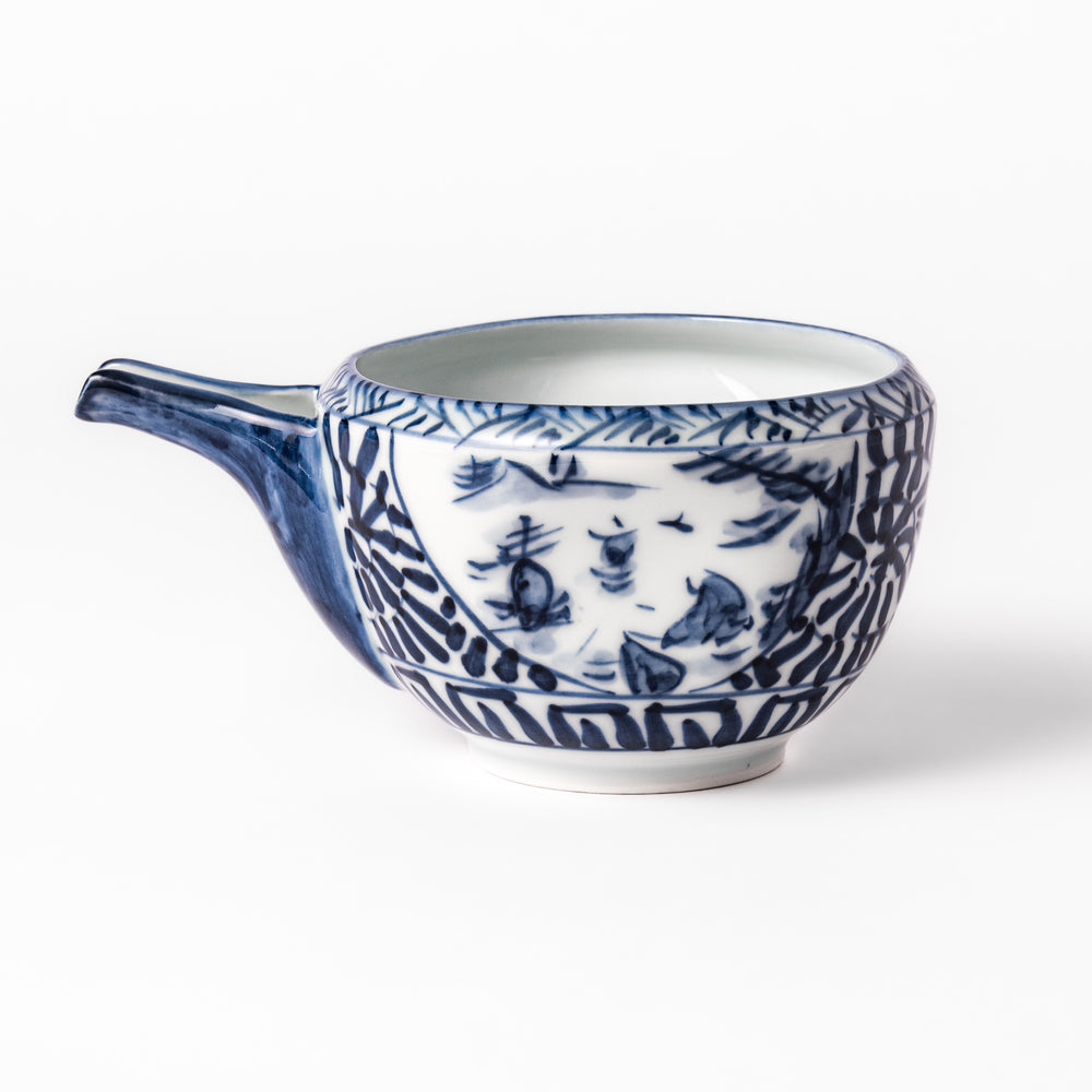 Porcelain sake pourer with spout featuring hand-painted indigo landscape and arabesque patterns in a traditional Japanese style.