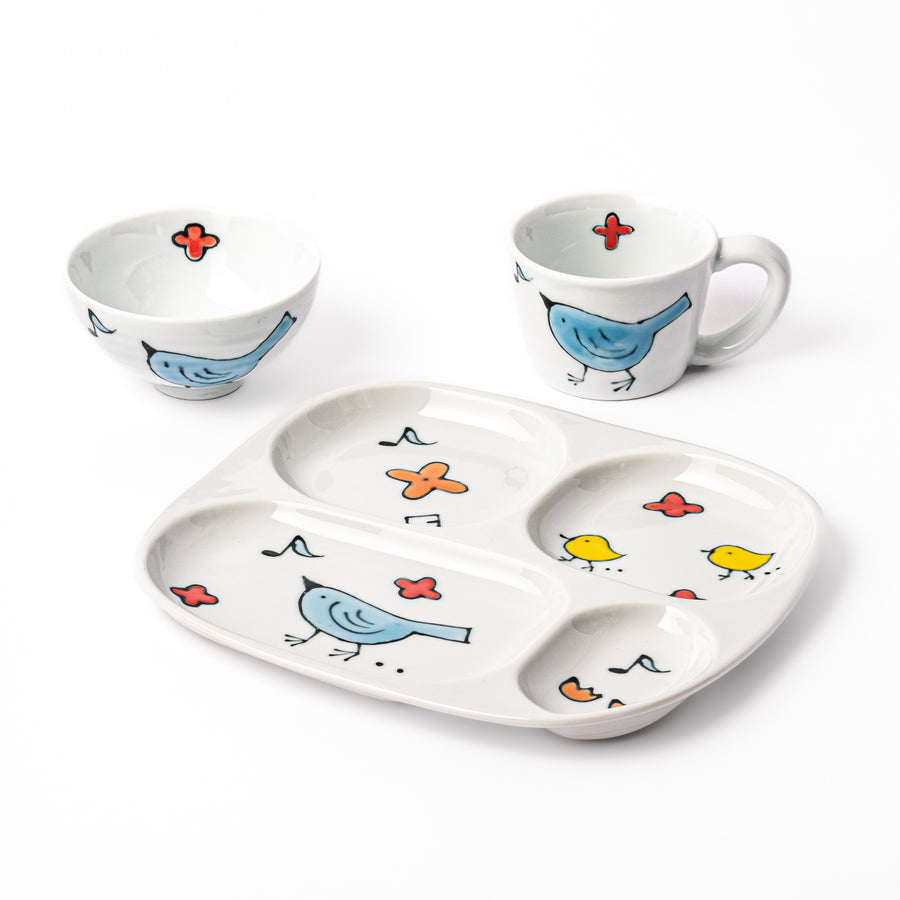 Blue Bird Kids Dinnerware Set featuring a divided plate, rice bowl, and mug with cheerful blue and yellow bird motifs designed to make children’s meals fun and inviting.