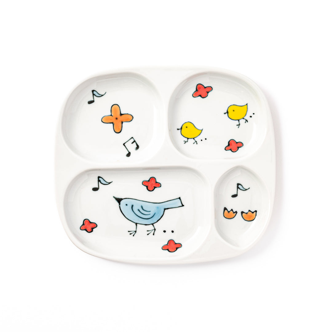 Japanese children’s divided plate decorated with colorful blue and yellow birds, flowers, and musical notes, designed for fun and easy mealtime organization.