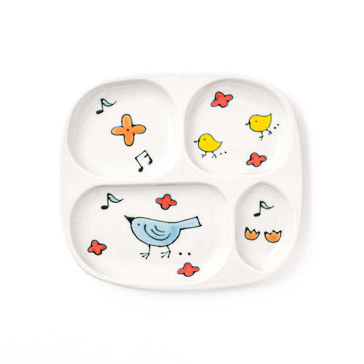 Japanese children’s divided plate decorated with colorful blue and yellow birds, flowers, and musical notes, designed for fun and easy mealtime organization.