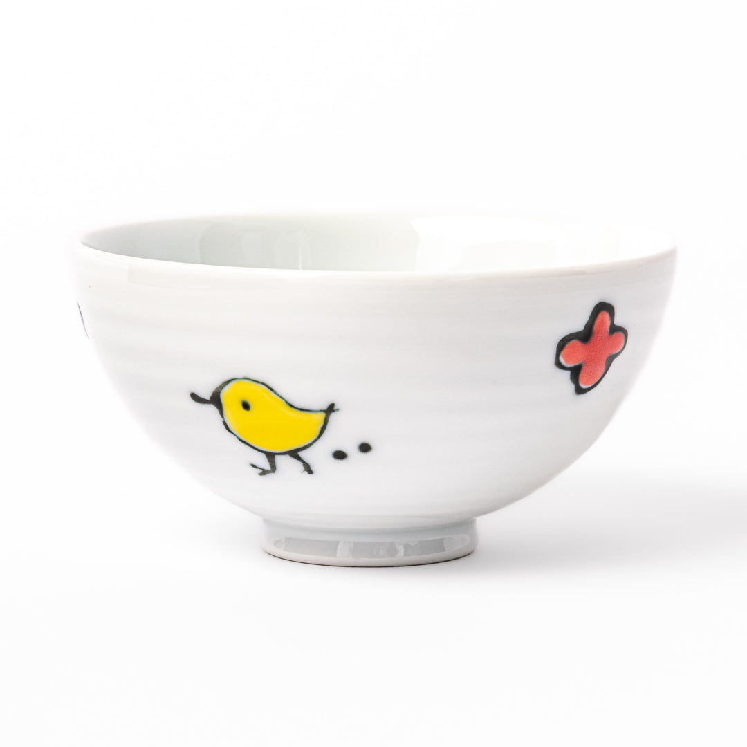 Japanese children’s rice bowl featuring a hand-painted blue bird and musical note motif on white porcelain, designed to bring a cheerful touch to everyday meals.