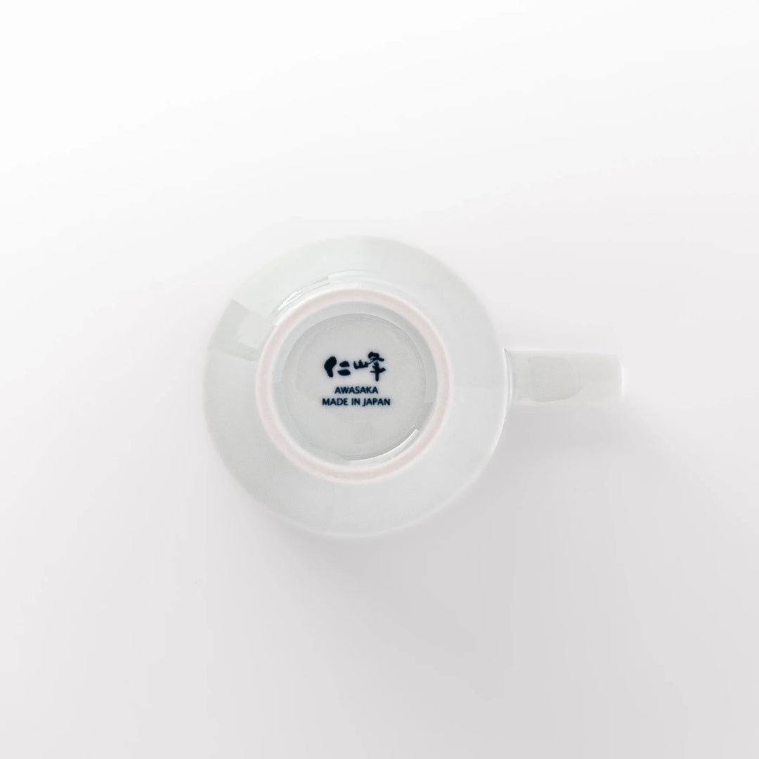 Japanese porcelain mug featuring Hokusai Great Wave and red-blue geometric patterns, crafted with elegant traditional design.