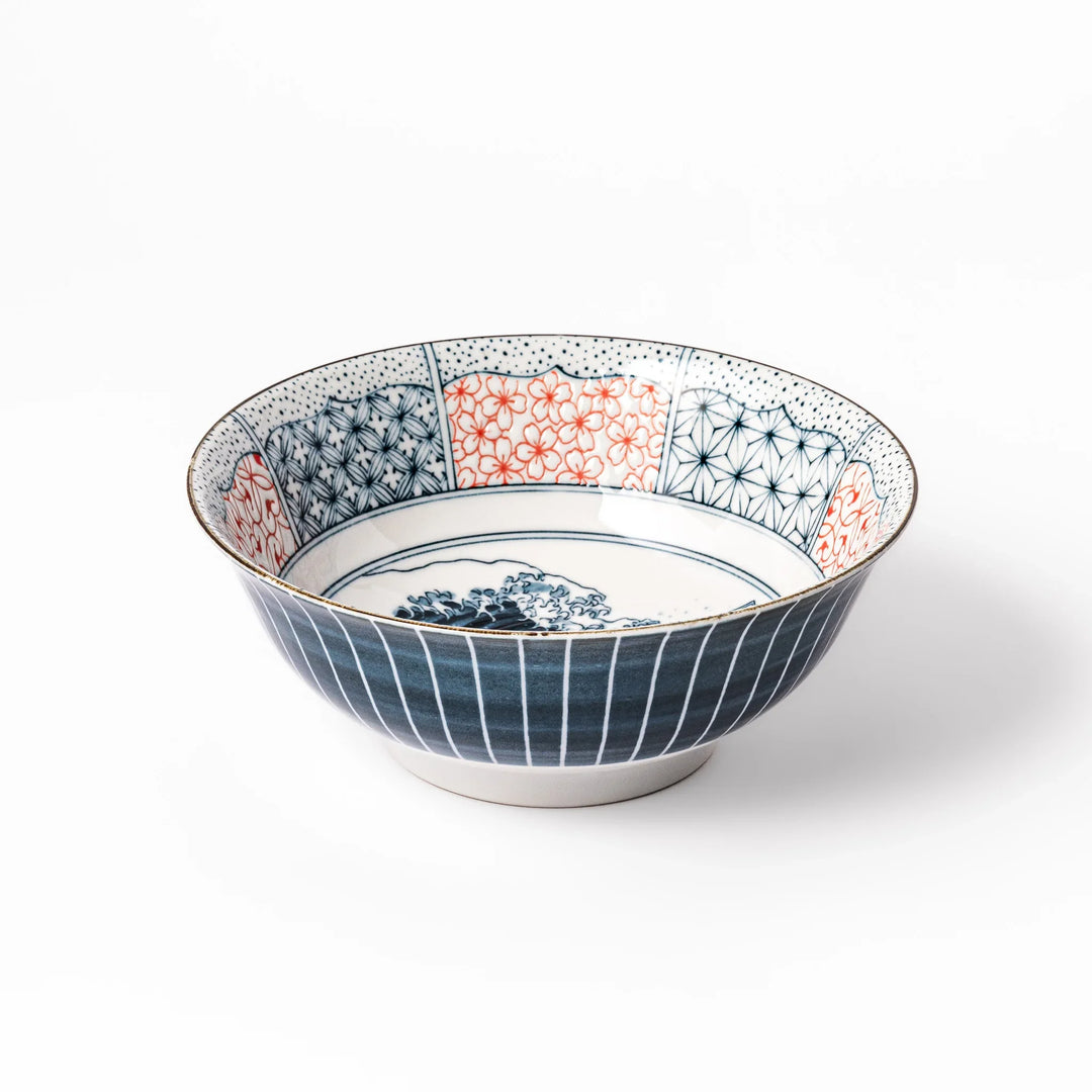 Japanese porcelain ramen bowl featuring Hokusai Great Wave design with red and blue geometric patterns in traditional style.