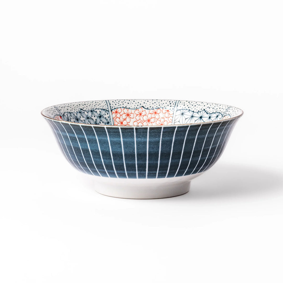 Japanese porcelain ramen bowl featuring Hokusai Great Wave design with red and blue geometric patterns in traditional style.