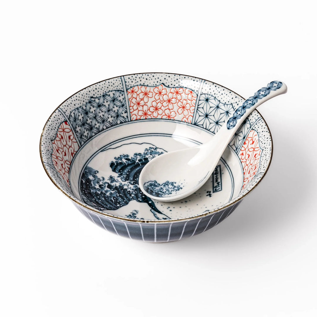 Japanese porcelain ramen bowl and spoon featuring Hokusai Great Wave design with red and blue geometric border patterns.