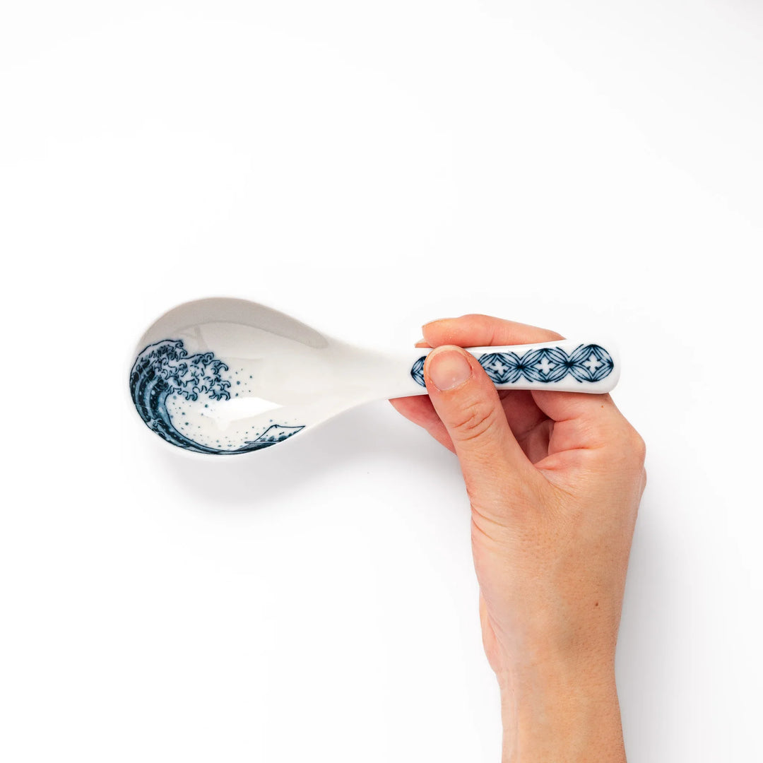 Japanese porcelain ramen spoon featuring Hokusai Great Wave and Mount Fuji design in classic blue and white style.