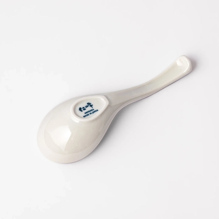 Japanese porcelain ramen spoon featuring Hokusai Great Wave and Mount Fuji design in classic blue and white style.