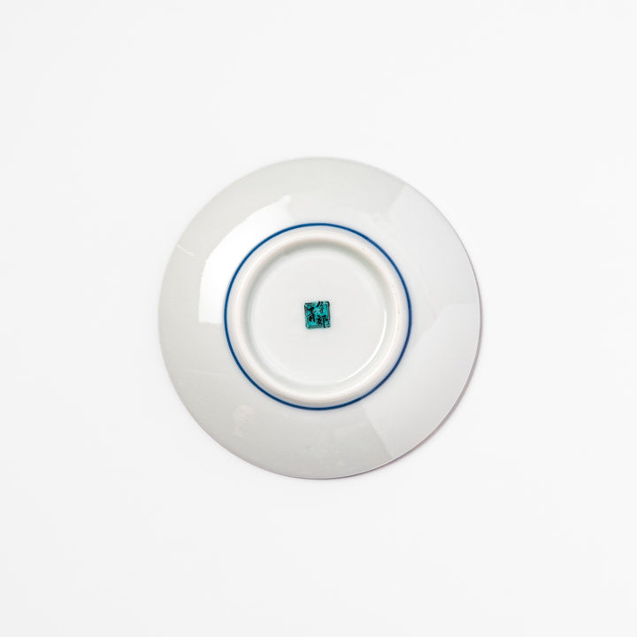Blue Japanese ceramic sauce dish adorned with white sakura blossom and petals, ideal for traditional dining and serving soy sauce or condiments.