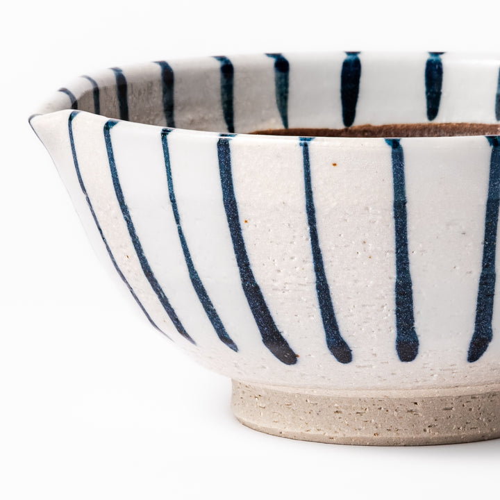White ceramic suribachi mortar with vertical blue stripes and a textured brown interior, ideal for grinding sesame seeds and traditional Japanese seasonings.