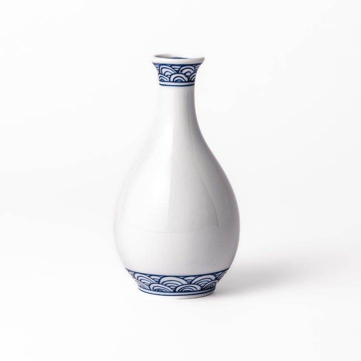 Porcelain sake flask with a smooth white body accented by traditional blue seigaiha wave patterns around the neck and base.