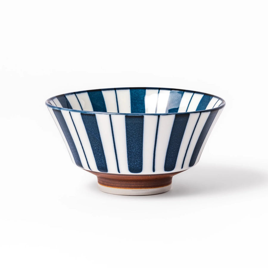 Japanese porcelain rice bowl with bold indigo and white stripe pattern and terracotta base, crafted in modern traditional style.