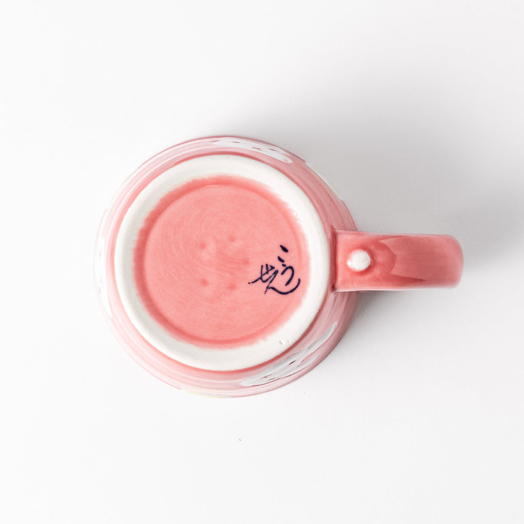 Adorable pink kids' mug featuring a cute bunny design and yellow accents, perfect for young children and adding a fun touch to mealtime.