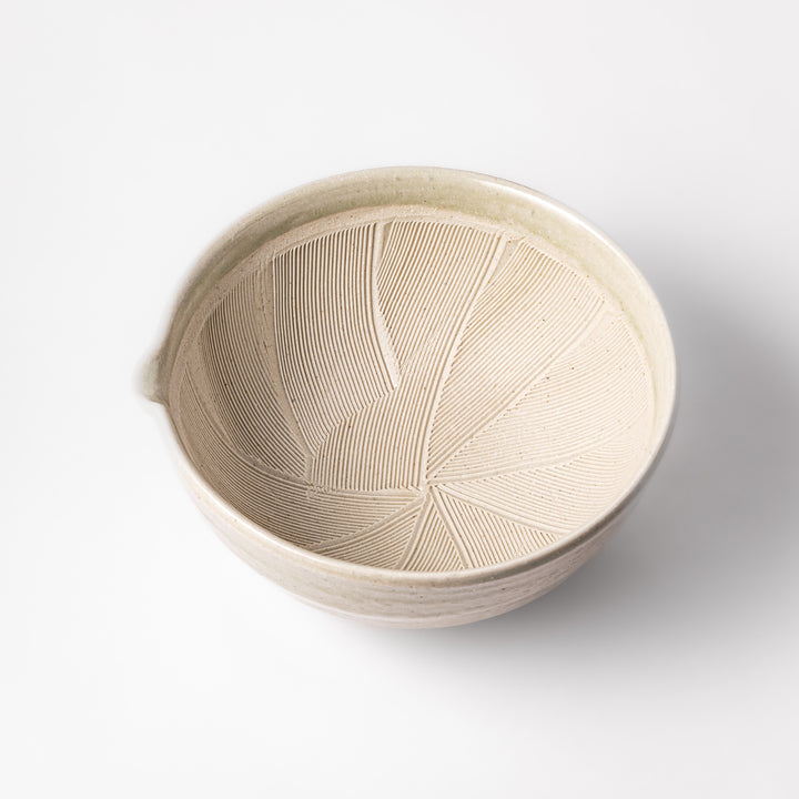 Celadon green Japanese suribachi mortar with finely grooved interior and pouring spout, perfect for grinding sesame seeds and preparing traditional sauces.