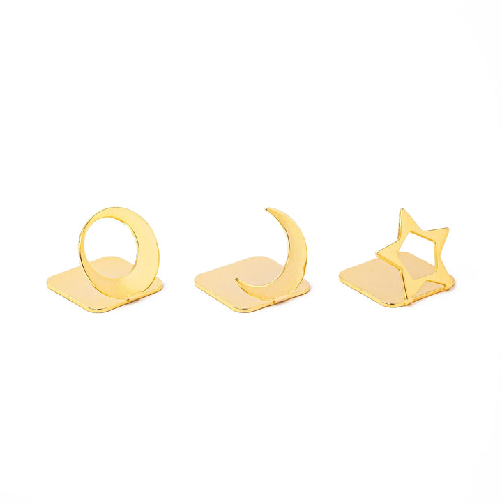 Three elegant Japanese celestial gold chopstick rests in unique moon and star shapes luxury metal hashioki set