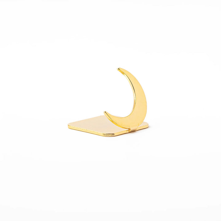 Celestial gold chopstick rest showing unique curved crescent moon design metallic elegant hashioki holder