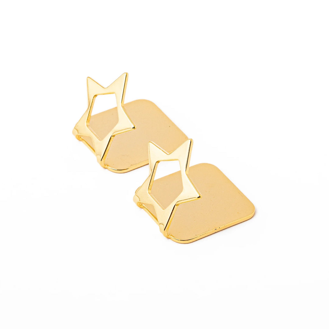 Set of two elegant celestial gold chopstick rests featuring unique hollow star shapes luxury metal hashioki