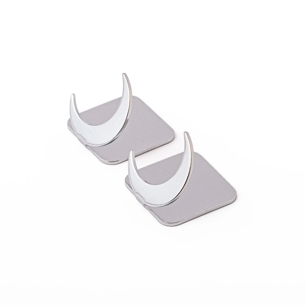 Set of two elegant celestial silver chopstick rests featuring unique crescent moon shapes sleek metal hashioki