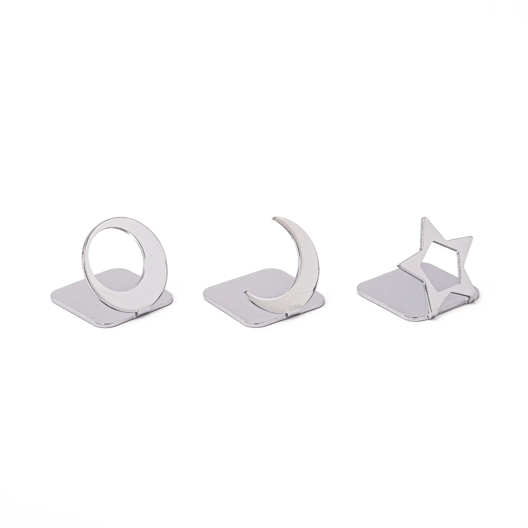 Three modern Japanese celestial silver chopstick rests in unique moon and star shapes sleek metal hashioki set