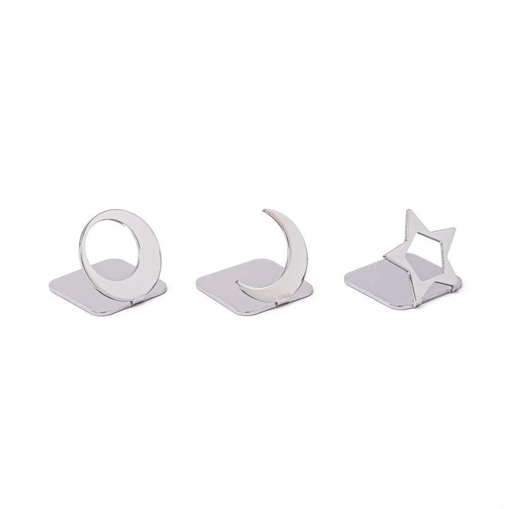 Three modern Japanese celestial silver chopstick rests in unique moon and star shapes sleek metal hashioki set