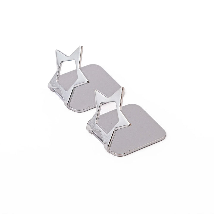 Set of two elegant celestial silver chopstick rests featuring unique hollow star shapes sleek metal hashioki